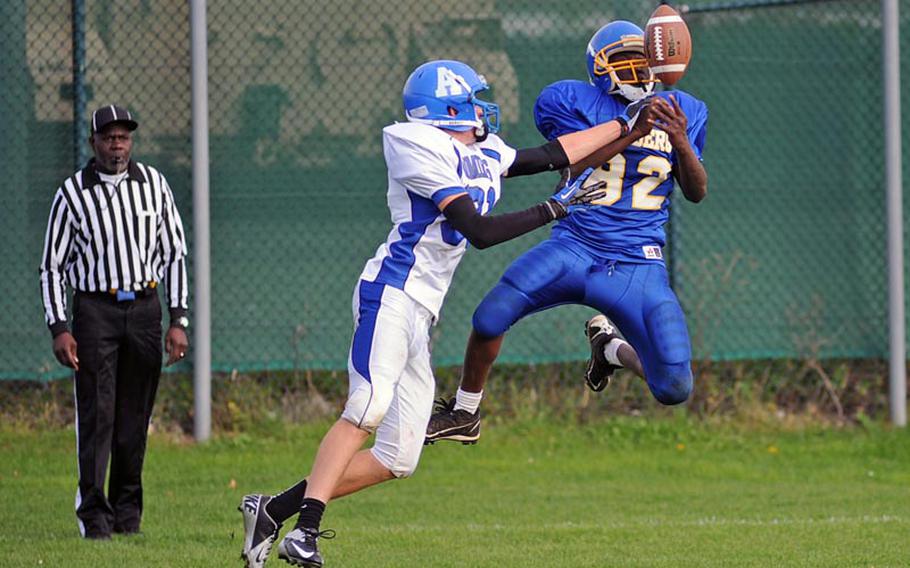 Bamberg's Andray Gibson, right, pulls in a pass despite the defense of Rota's Brooks Furleigh. Bamberg defeated Rota 22-12 at home Saturday.