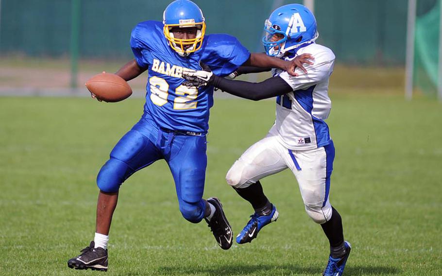 Bamberg's Andray Gibson picks up yardage as Rota's KC Mason tries to defend. Bamberg defeated Rota 22-12 in a Division III game at home Saturday.