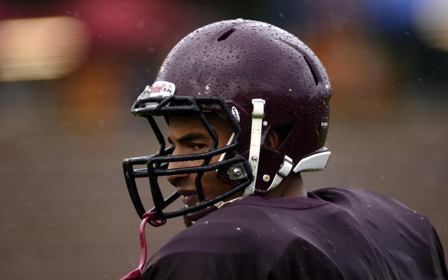 Baumholder High School's Ben McDaniels glances toward the stands on his way back to his team's  huddle. McDaniels led his team to a rain-soaked 2012 DODDS-Europe football championship in Baumholder, Germany. McDaniels was named Stars and Stripes' football Athlete of the Year.