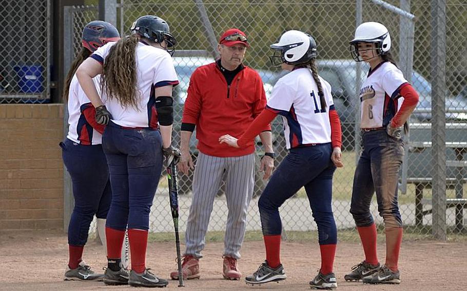 Lakenheath coach John Gilmore strategizes with his team during the second game of a softball doubleheader against SHAPE at RAF Lakenheath, England, Saturday, April 22, 2017.