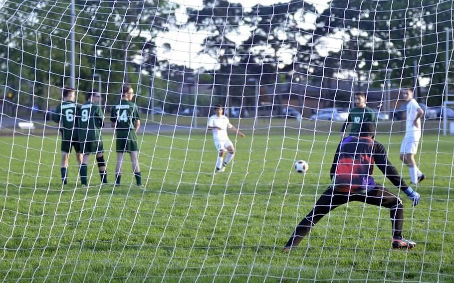 Goalkeeper Daniel Doctor defends against a Lakenheath penalty kick during the last game of the regular season at RAF Lakenheath, England, Friday, May 12, 2017.