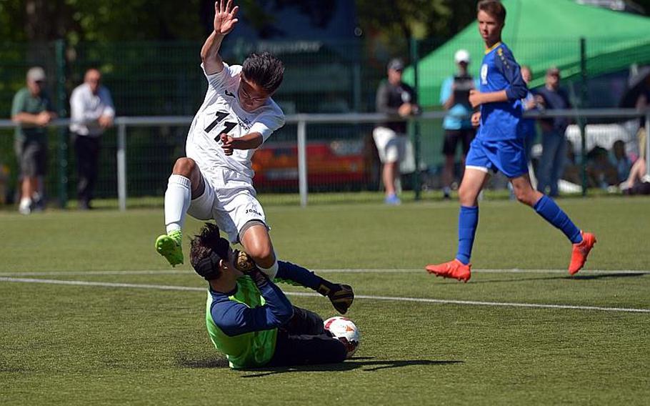 Wiesbaden keeper Matias Chavez comes out to stop Naples' Ryan Ramirez in a Division I game at the DODEA-Europe soccer championships in Reichenbach, Germany. Naples won the game 2-1.