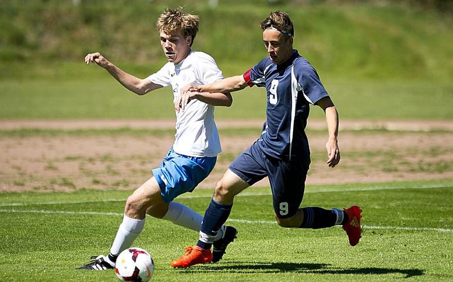 Bitburg's Sage Kown, right, and Marymount's Giovanni Taricone race for the ball during the DODEA-Europe soccer tournament in Landstuhl, Germany, on Wednesday, May 17, 2017. Marymount won the Division II match 3-1.

MICHAEL B. KELLER/STARS AND STRIPES