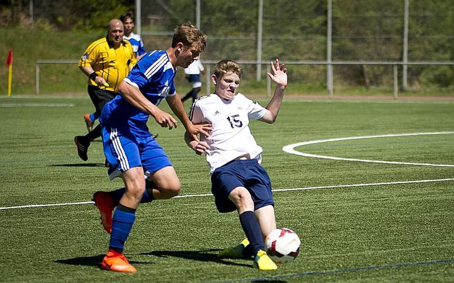 Black Forest Academy's Jonah Olson, right, tries to pass the ball past Rota's Samuel Weaver during the DODEA-Europe soccer tournament in Landstuhl, Germany, on Wednesday, May 17, 2017. Rota and BFA finished the the Division II match 2-2.

MICHAEL B. KELLER/STARS AND STRIPES