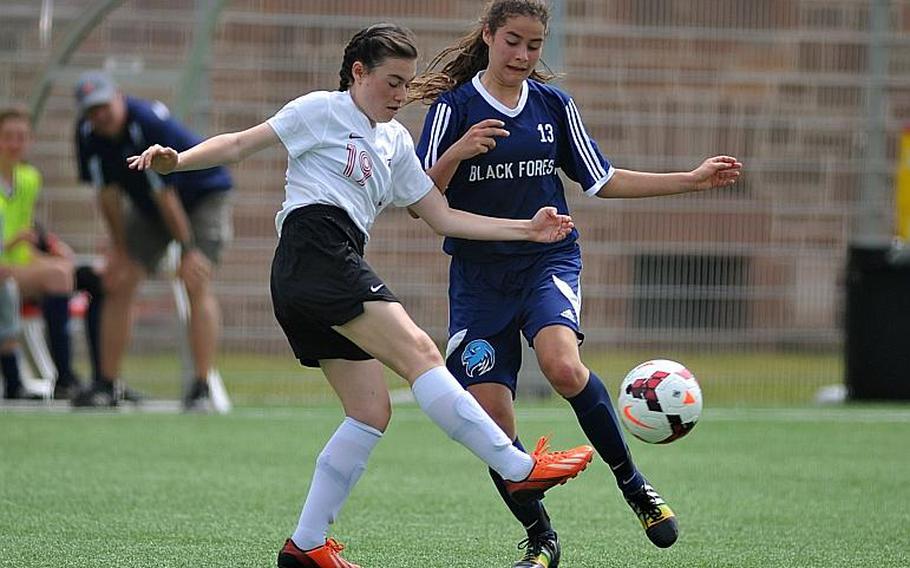 American Overseas School of Rome's Sofia Gaeta clears the ball in front of Black Forest Academy's Deborah Widmer in Division II action at the DODEA-Europe soccer championships in Landstuhl, Germany. BFA won 4-1.