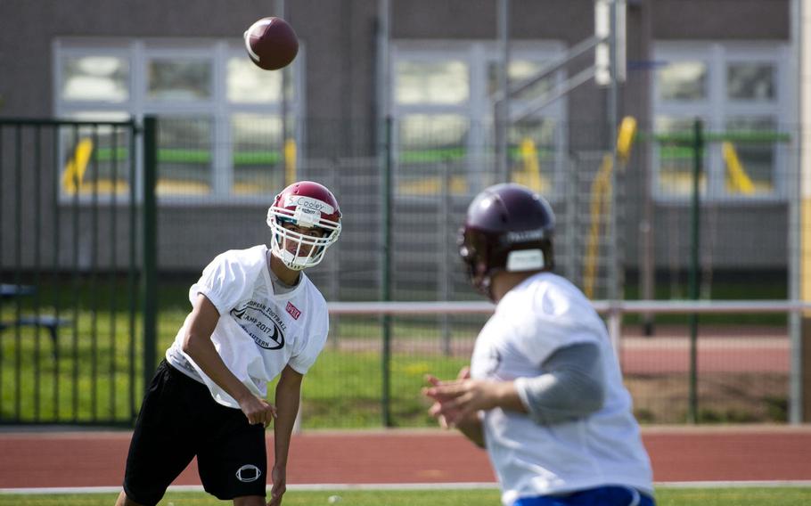 Kaiserslautern's Stephan Cooley, left, passes the ball to Vilseck's Juan Oestreich during football camp at Vogelweh, Germany, on Tuesday, Aug. 15, 2017.