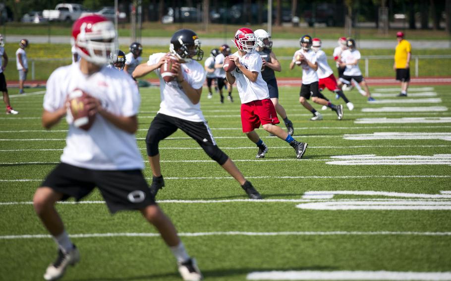 Players practice passing during the annual European Football Camp at Vogelweh, Germany, on Tuesday, Aug. 15, 2017. Some 200 DODEA-Europe and local national football players participated.