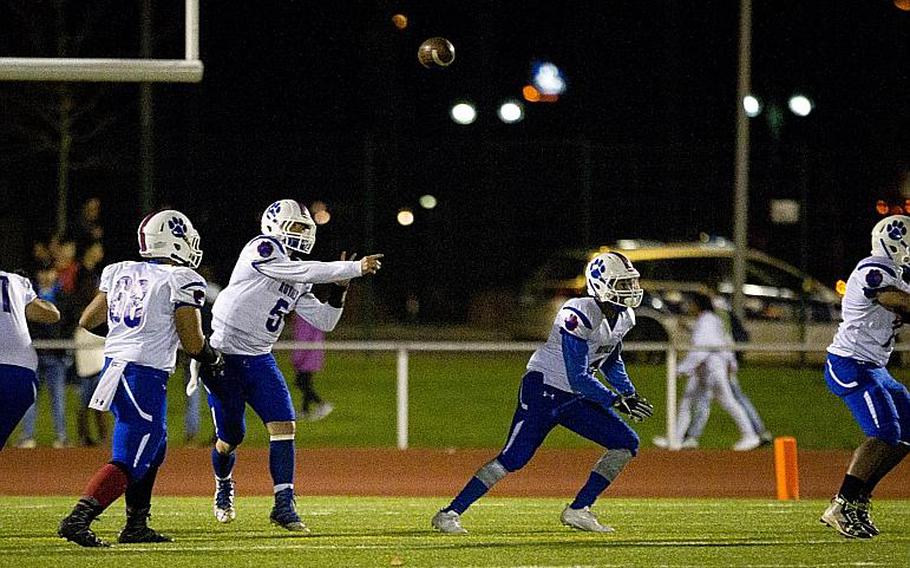 Ramstein's Trevor Miller throws a pass at Vogelweh, Germany, on Saturday, Nov. 4, 2017.