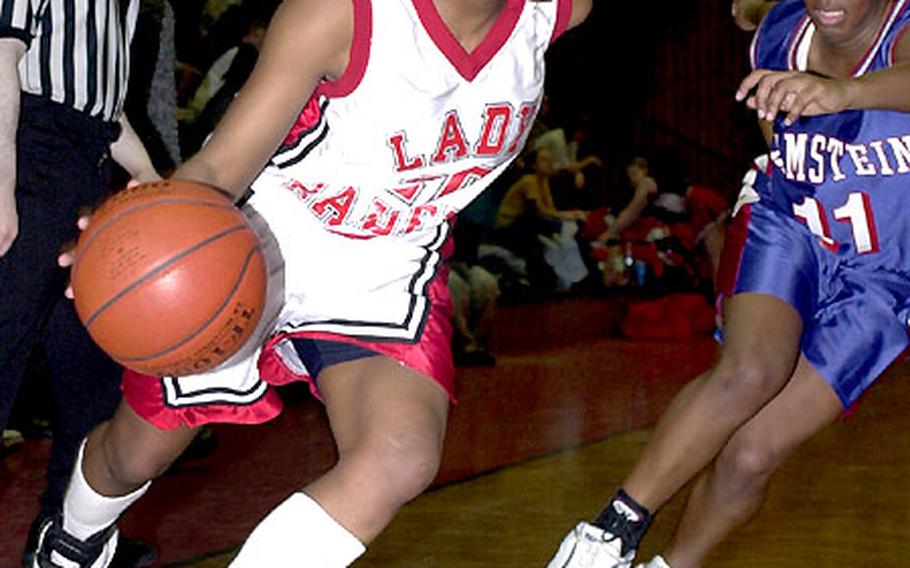 Layla Hicks of Kaiserslautern drives past Ramstein&#39;s Tanya West in a game last season.