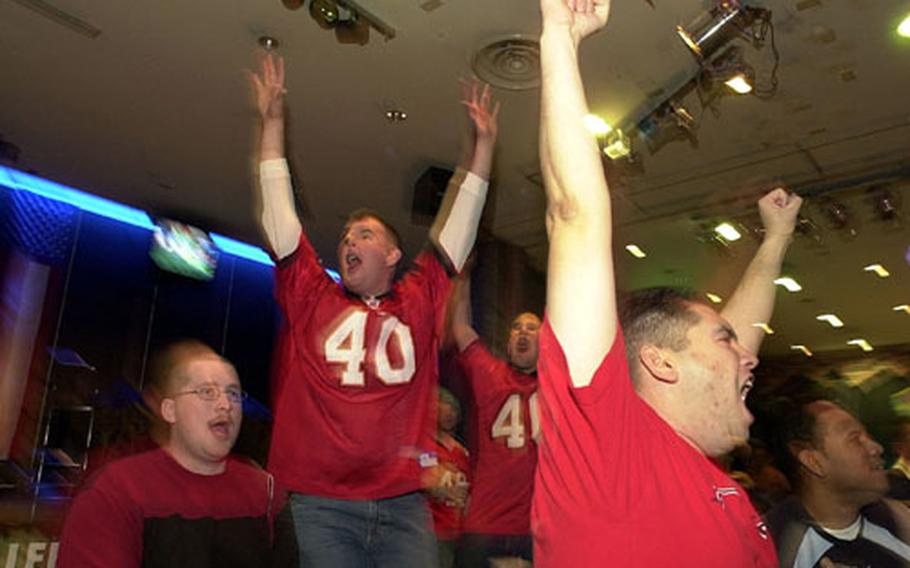 Tampa Bay Buccaneer fans rejoice while watching the Super Bowl at Club Trilogy on Monday.