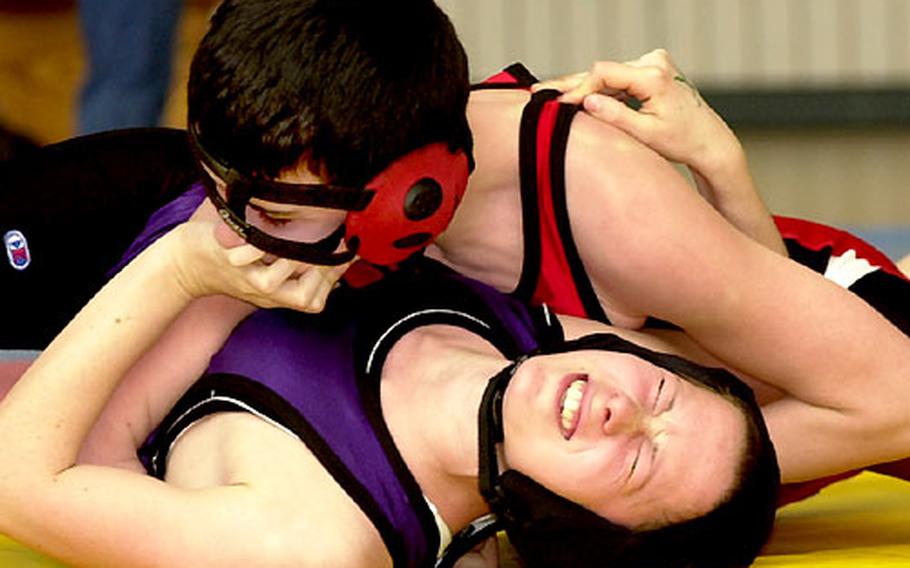 Wurzburg&#39;s Liz Barry, bottom, struggles to avoid the pin by Kaiserslautern&#39;s Jamie Jung in a opening-round 130-pound bout. She escaped here, but Jung pinned her later in the match.