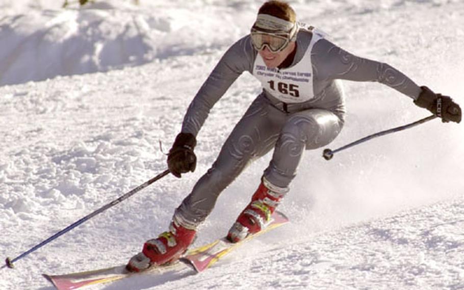 Mark Marchant races down the piste in the ski giant slalom event at the 2003 U.S. Forces Europe Ski and Snowboard Series in Garmish on Saturday. Marchant captured the Mens&#39; Military Masters class with a time of 1:32.44.