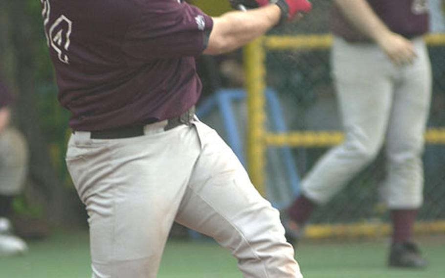 Left-fielder Anthony Salas of Zama American connects on a second-inning grand slam home run during the opener of Tuesday&#39;s Kanto Plain Association of Secondary Schools doubleheader at St. Mary&#39;s International School in southwest Tokyo.