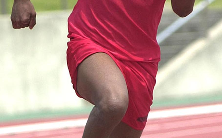 Brenden Lynce of Nile C. Kinnick turns the corner in the 200-meter dash during Saturday&#39;s Kanto Plain Association of Secondary Schools season-ending track and field championships. Lynce, who won gold in the 110 and 400 hurdles, placed second in the 200 with a time of 23.8 seconds, seven-tenths slower than winner Issey Maholo of St. Mary&#39;s International.