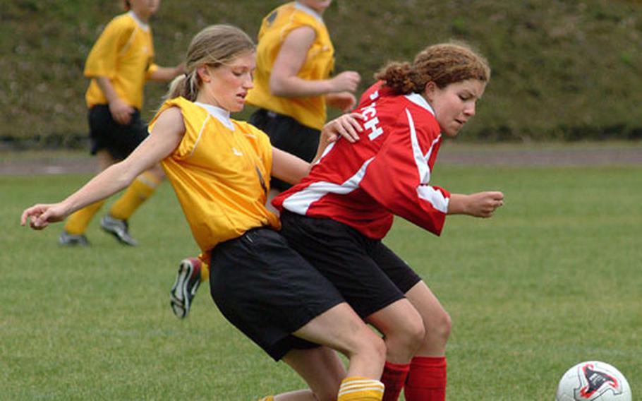 Hanau&#39;s Patricia Foster (left) battles Patch&#39;s Laura Ingold for the ball during Saturday&#39;s Division II girls&#39; soccer championship in Brunssum, Netherlands.