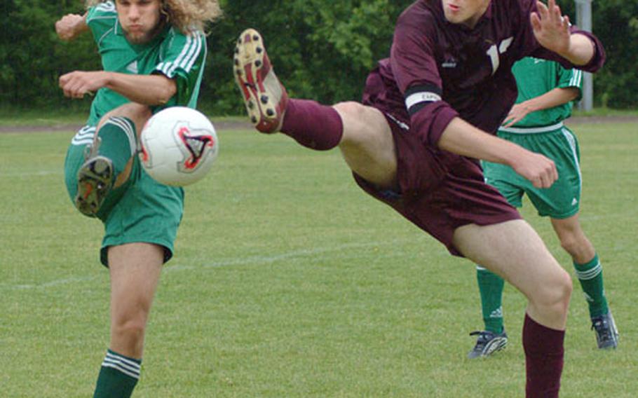 Shape&#39;s Andreas Skotheim (left) battles Vilseck&#39;s Chris Lamp during Saturday&#39;s Division II soccer championship at Brunssum, Netherlands. In back is Shape defender Alexander Martinez.