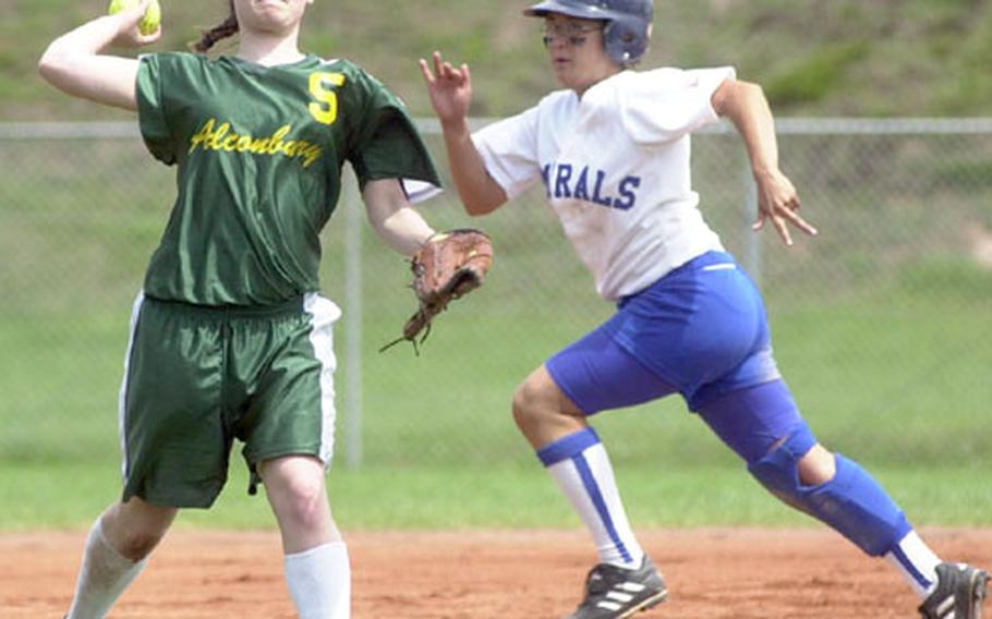 Alconbury&#39;s Alicia Christensen, left, fields a ground ball and throws to first as Rota&#39;s Karen O&#39;Neal advances to third during the DODDS Division III high school softball championships in Landstuhl, Germany, on Saturday.