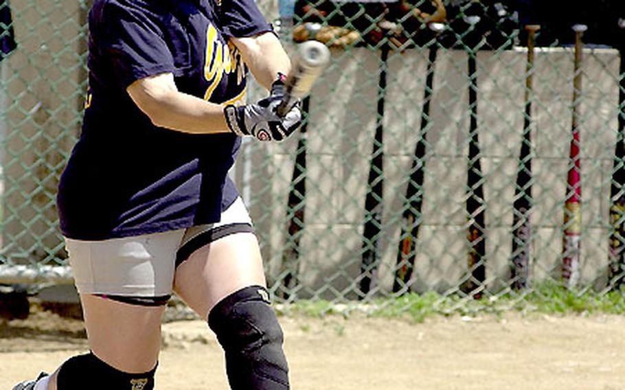 Alicia Moore of the Okinawa TPS Diamonds rips a single in the bottom of the seventh inning of the second game during Monday&#39;s women&#39;s championship.