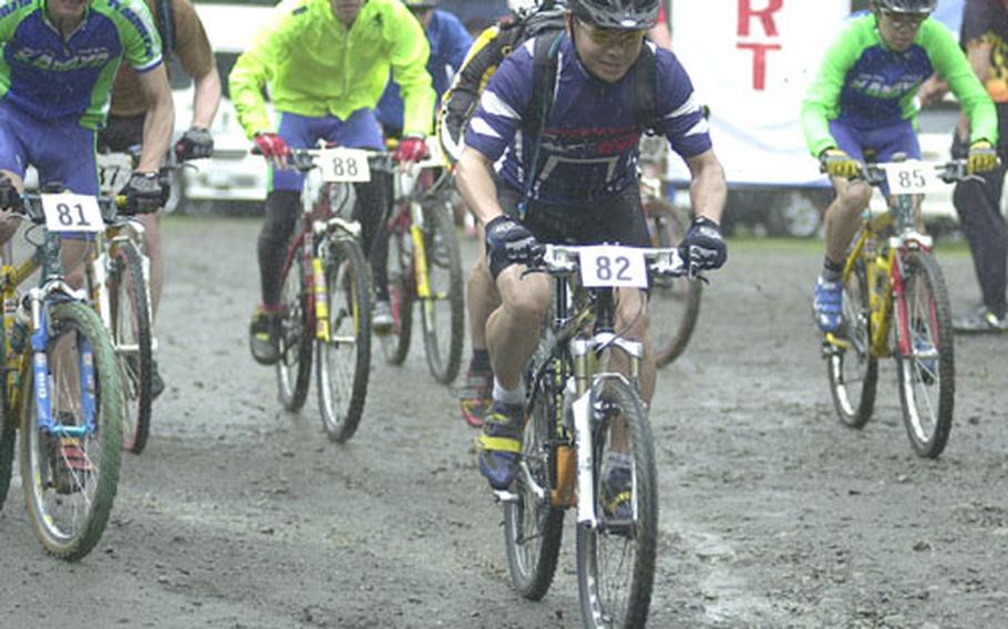 A gaggle of riders take off at the start of the men&#39;s open division portion of the 12th Tour de Tama mountain bicycle race at Tama Hills Recreation Center, Japan.