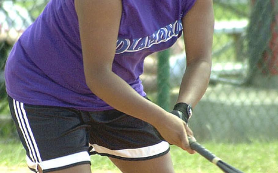 Outfielder Theresa Gittens of Okinawa&#39;s TPS Diamonds laces a single to center field during Oct. 14, 2002&#39;s, women&#39;s championship game in the 18th Typhoon Classic Invitational Interservice Softball Tournament at Torii Station, Okinawa. Gittens shares Stars and Stripes Pacific high school female Athlete of the Year honors with sophomore Brieanna Carroll of Pusan American.