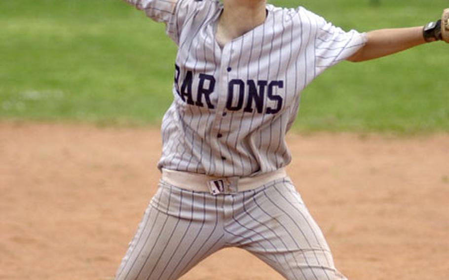 Bitburg&#39;s All-Europe pitcher Tanja Moore winds up for a pitch during a high school double-header softball game in Mannheim, Germany, on Saturday. Bitburg defeated Mannheim 15-4 in the first game. Moore was once again named to the All-Europe softball team.
