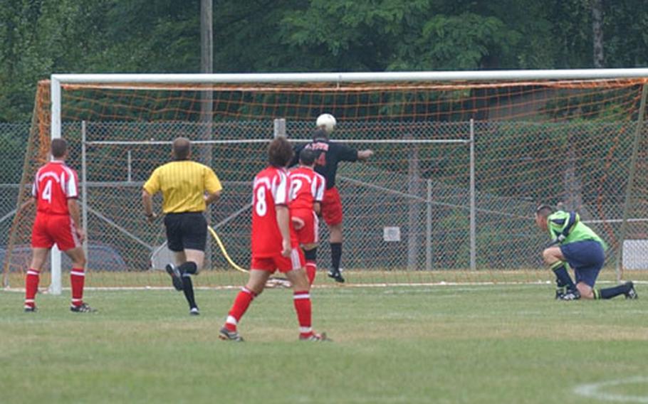 Leslie Barnwell heads in the first goal for Kaiserslautern.