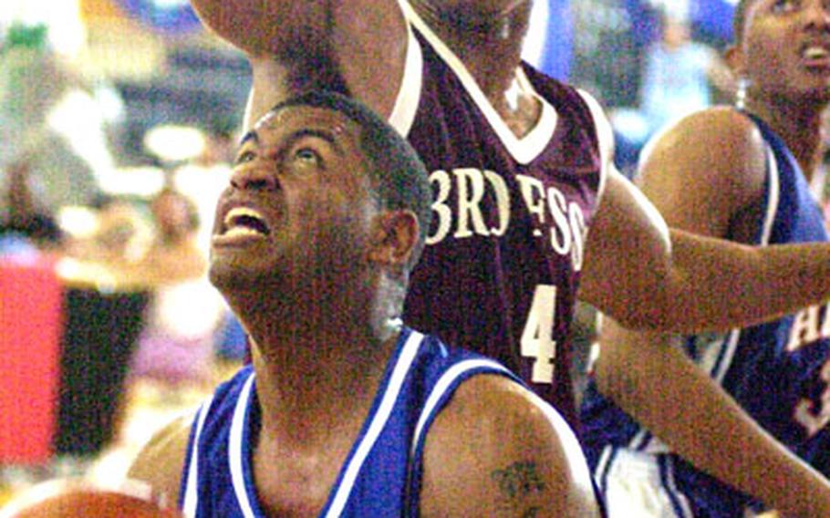 Aaron McNeal of Marine Corps Base Hawaii looks to shoot as 3rd Force Service Support Group&#39;s Clifford Sales (4) defends during Monday&#39;s round-robin play. Hawaii routed 3rd Force 104-66.