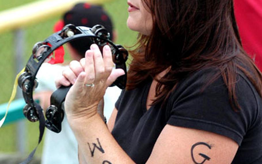 A fan of the Belgium team, which played Germany in the second semifinal game, shows her support in written form on her arm.