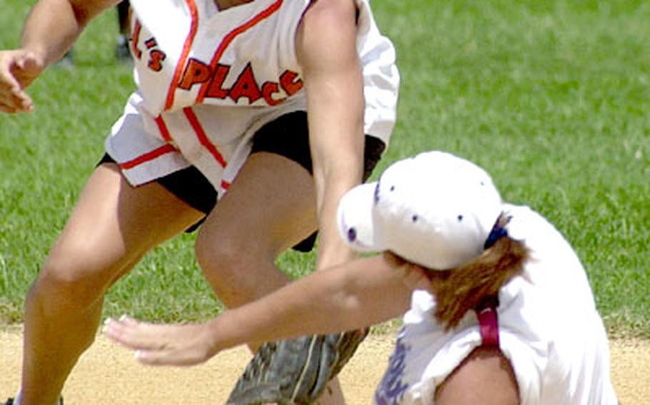 Second baseman Brandy Stone of Al&#39;s Place of Okinawa puts a tag on Okinawa TPS Diamonds baserunner Gina Tash during Monday&#39;s women&#39;s championship game, TPS beat Al&#39;s Place 15-2.