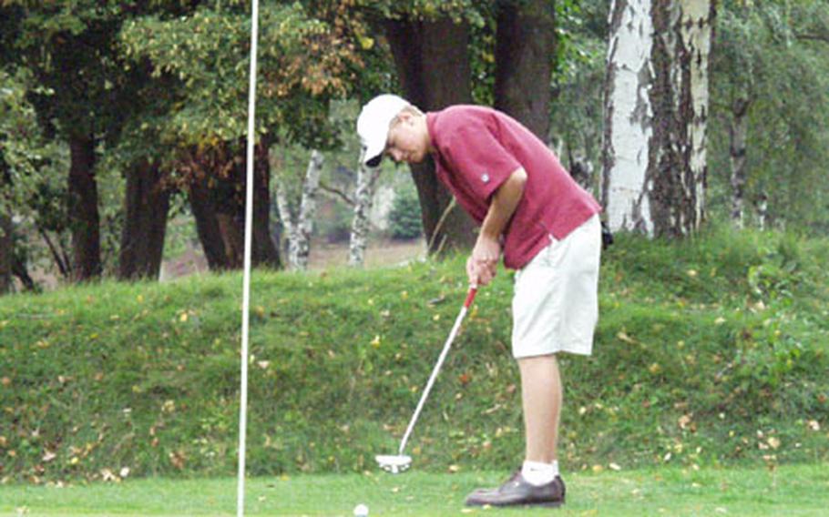 Heidelberg junior Greg Nyander rolls in a 12-foot birdie putt from the fringe Wednesday during a practice round at the Heidelberg Golf Club, Germany.