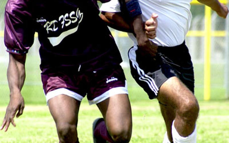 Jimmy Sumaya, right, of Marine Corps Base Hawaii battles for the ball with Jimmy Joseph, left, of Okinawa&#39;s 3rd Force Service Support Group Defending champion Hawaii blanked 3rd Force 6-0.