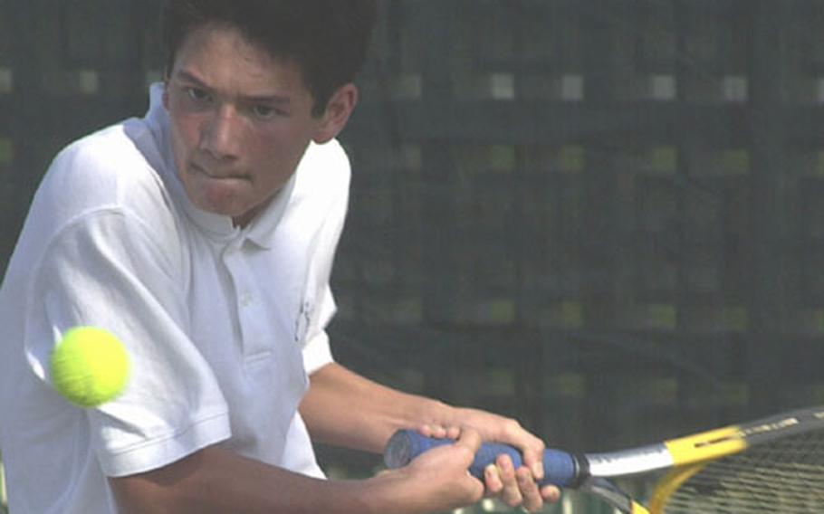 Andrew Soroka of the Kadena Panthers prepares a two-handed backhand against David Pate of the Kubasaki Dragons during Thursday&#39;s Okinawa Activities Council tennis meet at Risner Tennis Complex, Kadena Air Base, Okinawa. Soroka, the Panthers&#39; No. 1 singles seed, survived a close match 6-4, leading Kadena to a 4-0 sweep.