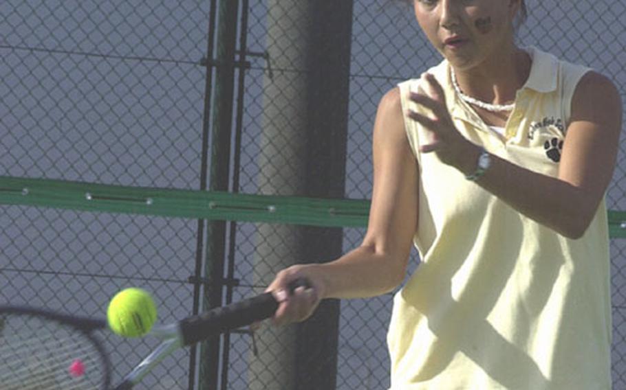 Lori Kanikkeberg of the Kadena Panthers fires a forehand groundstroke against Lori Guzman of the Kubasaki Dragons during Thursday&#39;s Okinawa Activities Council tennis meet at Risner Tennis Complex, Kadena Air Base, Okinawa. Kanikkeberg, the Panthers&#39; No. 1 singles seed, celebrated her 18th birthday with a 6-1 victory, leading Kadena to a 4-0 sweep.