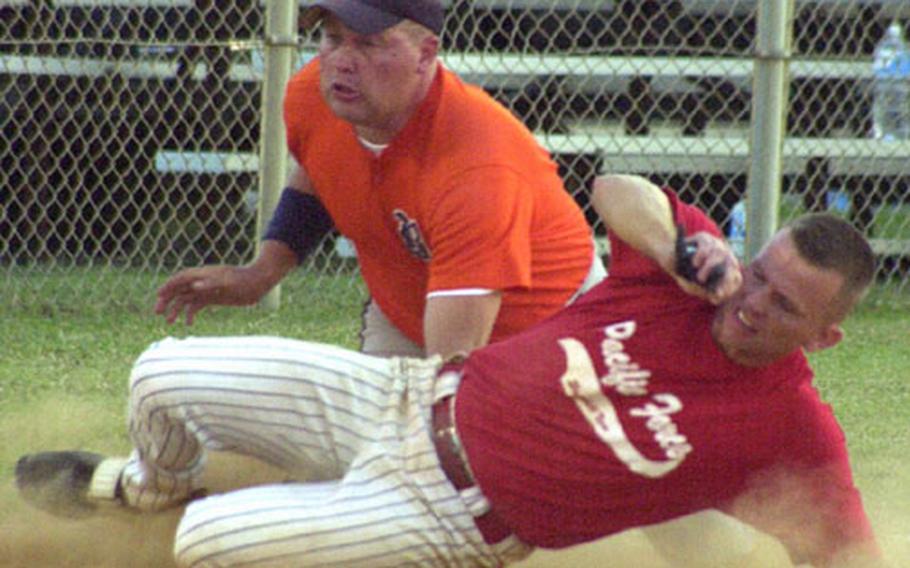 Gary Chaney of Pacific Force slides in safely at third base ahead of the tag of Chaz Chambers of BK&#39;s during Sunday&#39;s winner&#39;s bracket final of the 2003 Typhoon Classic Pacificwide Interservice Softball Tournament at Torii Station, Okinawa.