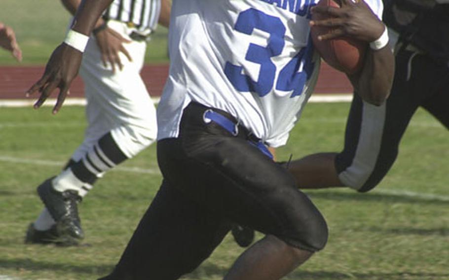 Kadena Islanders running back Keith Loving races for a first-quarter touchdown, one of three he scored against the Kubasaki Samurai during Friday&#39;s Okinawa Activities Council game.