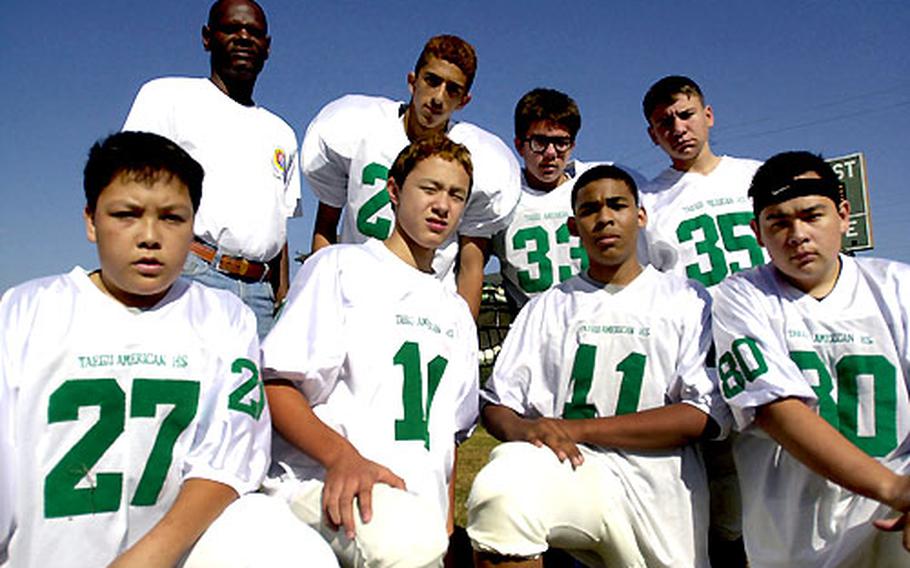 Seven members of Taegu American’s football team are students as Pusan, the school’s biggest rival. The schools are working together since neither had enough players to field a team of its own. Pictured above is the Pusan contingent. Front row, left to right: Jonathan Brunner, Chris Moye, Detlef Loyd and Aaron Brunner. Back row, left to right: Coach Robert Dickson, Chris Rodriguez, Conner Atwood and Robert Smith.