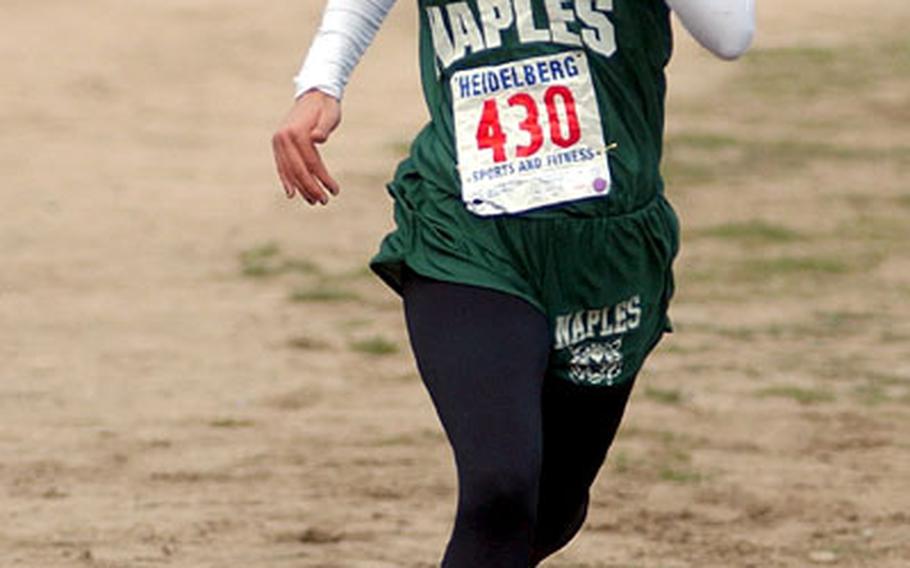 Naples’ Charity Williams pulls away from the pack on her way to victory at Saturday’s DODDS European Cross Country Championships.