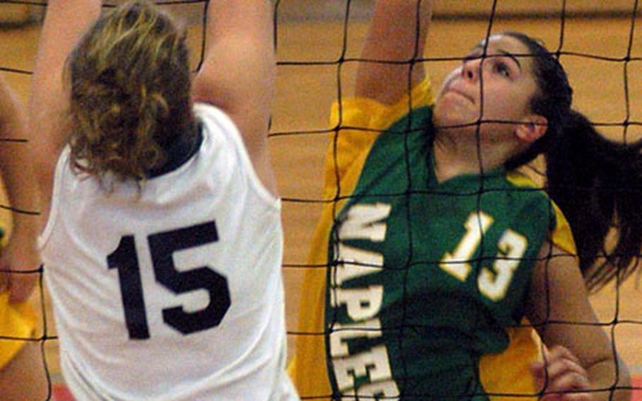 Renna Damon of Naples slams the ball back over the net against Caitlin Laingen of Alconbury on the first day of Division III action at the DODDS 2003 European Volleyball Championships in Mannheim on Friday. Alconbury won the match in three sets.