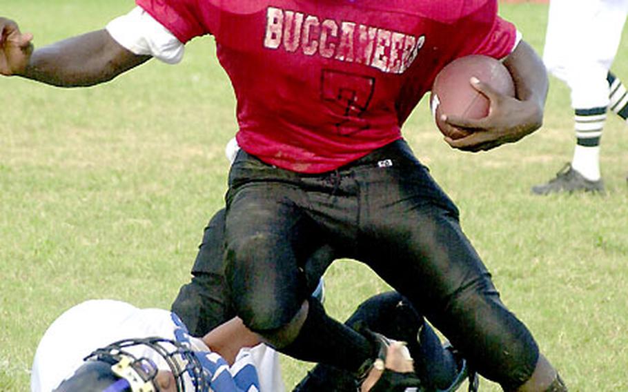 Kadena Buccaneers senior A.J. Morgan (with ball) has 487 all-purpose yards and 5 TDs in the past two games.