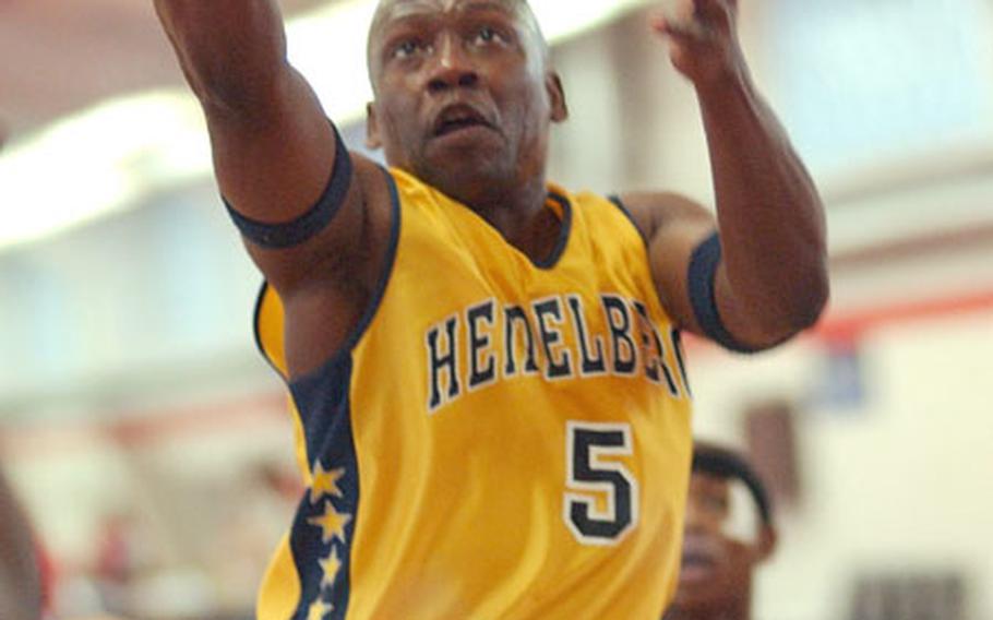 Heidelberg&#39;s Andre Barnes scores two points against Ramstein during the final game of the 2003 Kaiserslautern Christmas basketball tournament in Kaiserslautern, Germany, on Sunday.