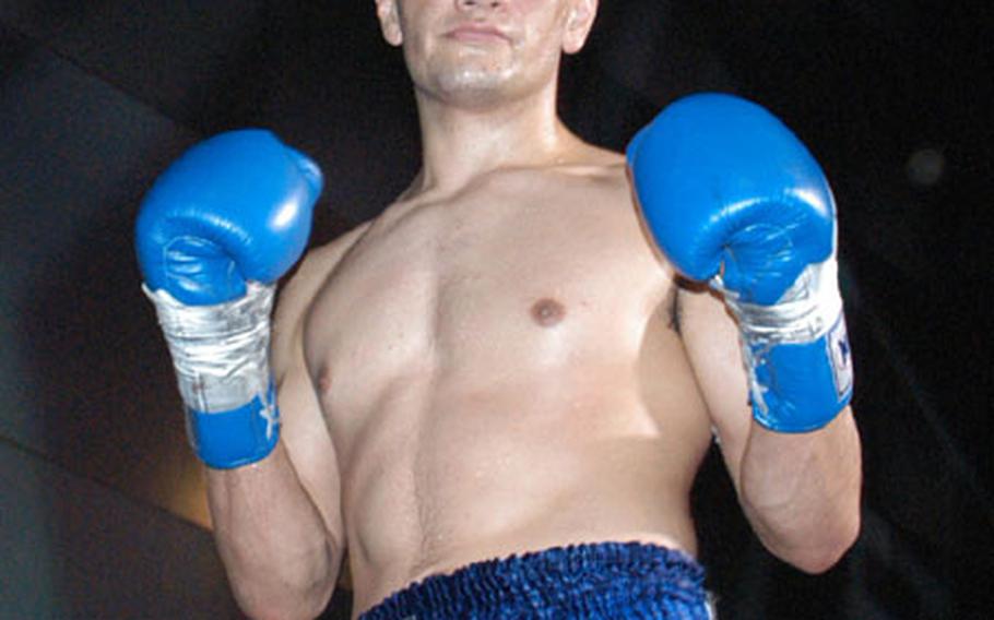 Senior Airman David Archuletta poses after his Jan. 24 victory in Tokyo.