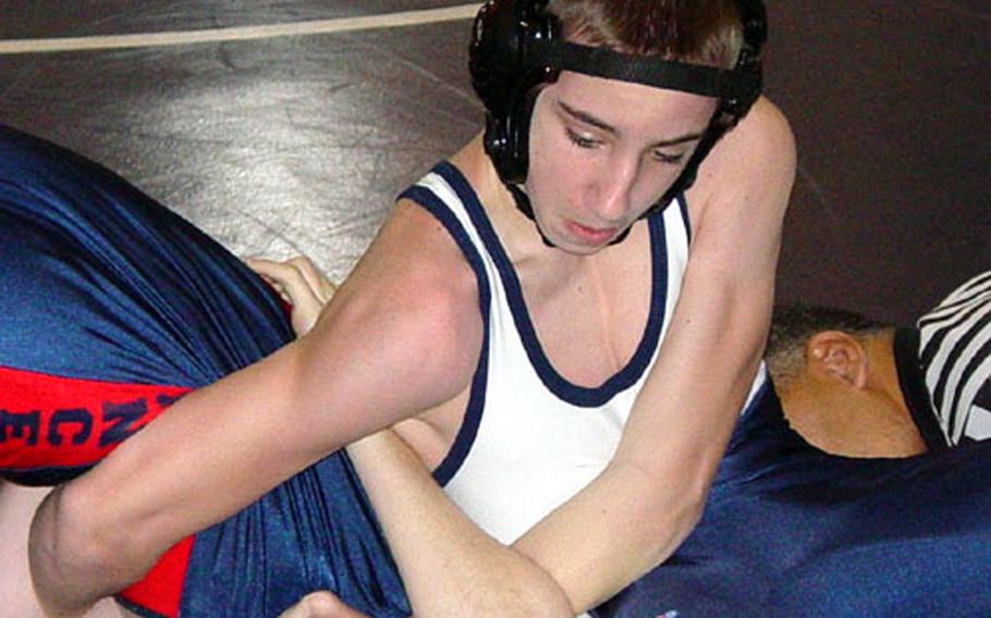 Bitburg 103-pounder Scotty McQuisten works on the pin he eventually scored in 1:56 against Logan Snow of Lakenheath. The two met Jan. 17 at a meet hosted by London Central.