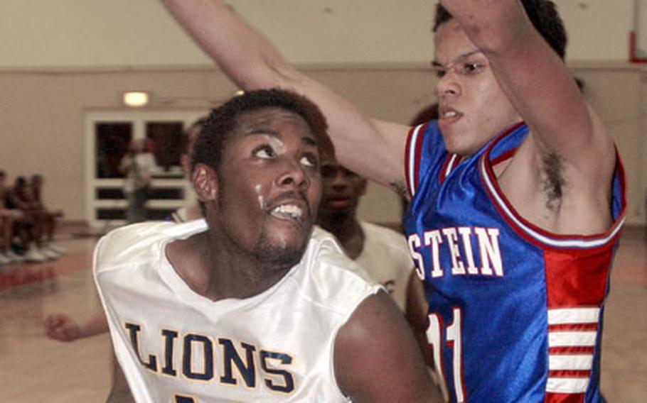 Heidelberg's Jamal John, left, looks to make a strong inside move against Ramstein's Brennan Relaford during the DODDS Division I championship game in Mannheim, Germany, on Saturday. Heidelberg captured its fifth straight title with a 51-47 victory.
