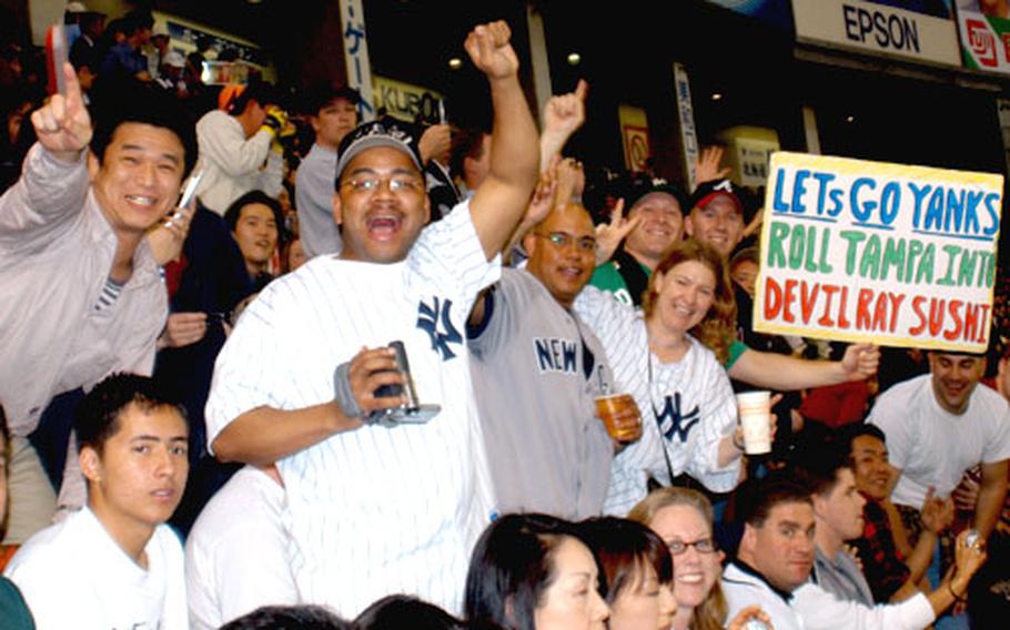 Yokota Air Base, Japan, residents pack into the left-field bleachers Tuesday night in the Tokyo Dome.