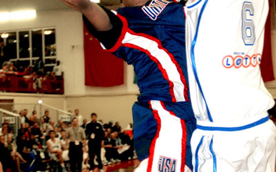 USA&#39;s Kyle Lowery drives to the basket against Italy&#39;s Davide Bruttini.