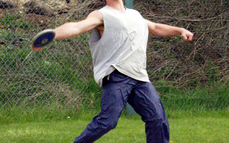 Chris Eubanks spins through one of his 21 full-form discus throws during practice Tuesday at Bitburg Air Base, Germany. Eubanks won the European title last spring with a heave of 147-2.