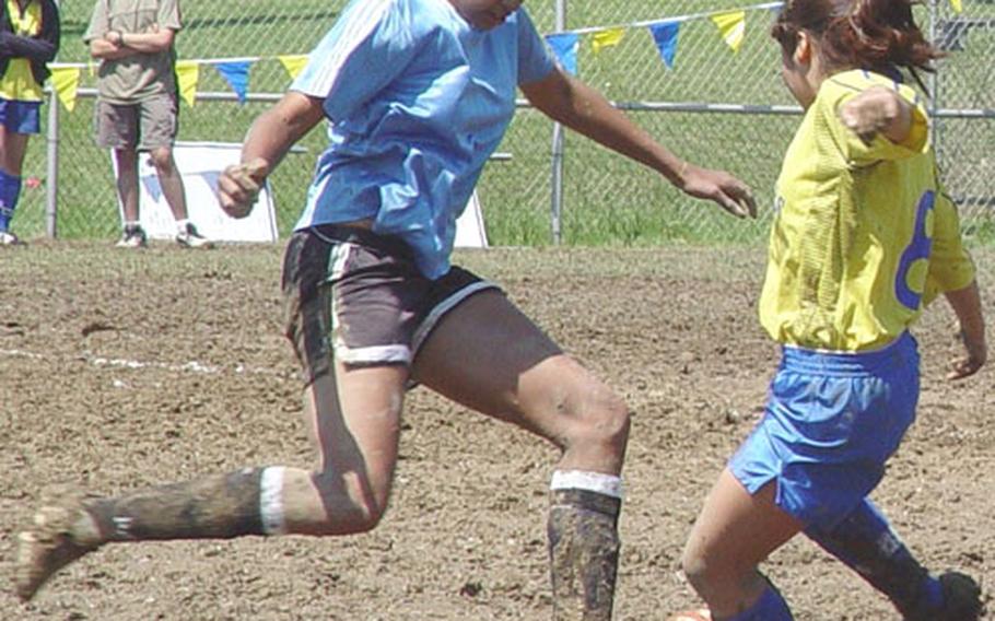 Sophomore Margaret Nurse, left, of the Osan American Cougars and senior Jennifer Oh of the Pusan American Panthers battle for the ball during Wednesday&#39;s semifinal of the 2004 Far East High School Girls Class A (small schools) Soccer Tournament at Hialeah Field, Camp Hialeah, Pusan, South Korea.