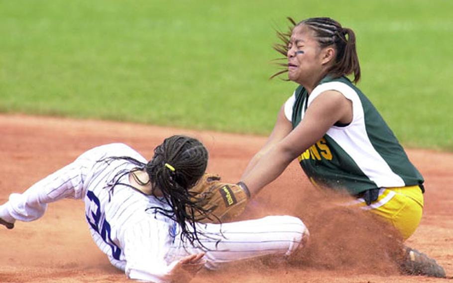 London Central Ashley Willis (left) slides into second under the tag of Alconbury&#39;s Jannel Acaba during Saturday&#39;s DODDS Division III European softball championship game in Ramstein, Germany.