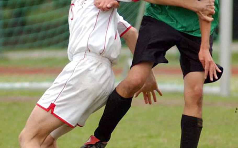 Naples&#39; Josh Kaimikaua, right, gets his head on the ball in front of Davide Lelli from American Overseas School of Rome during the DODDS European Division III Men&#39;s Soccer Championship in Kaiserslautern, Germany, on Friday.