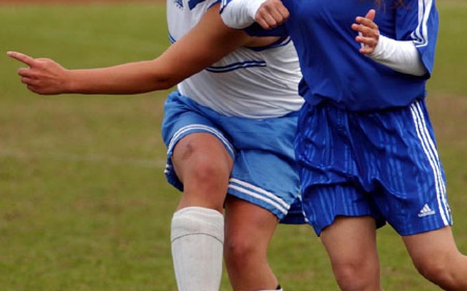 Black Forest Academy&#39;s Miriam Townsend, left, and Bitburg&#39;s Amanda Arp battle for possesion during the DODDS European Division II Girl&#39;s Soccer Championship game at Ramstein, Germany, on Saturday.